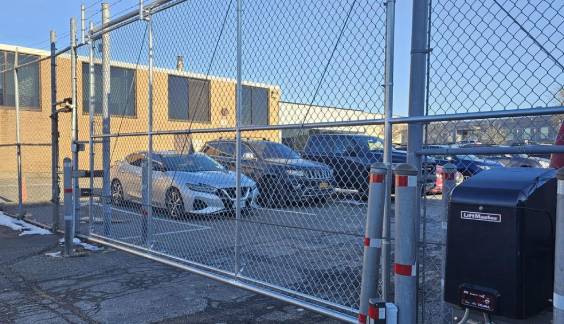 Cantilever sliding chain link fence