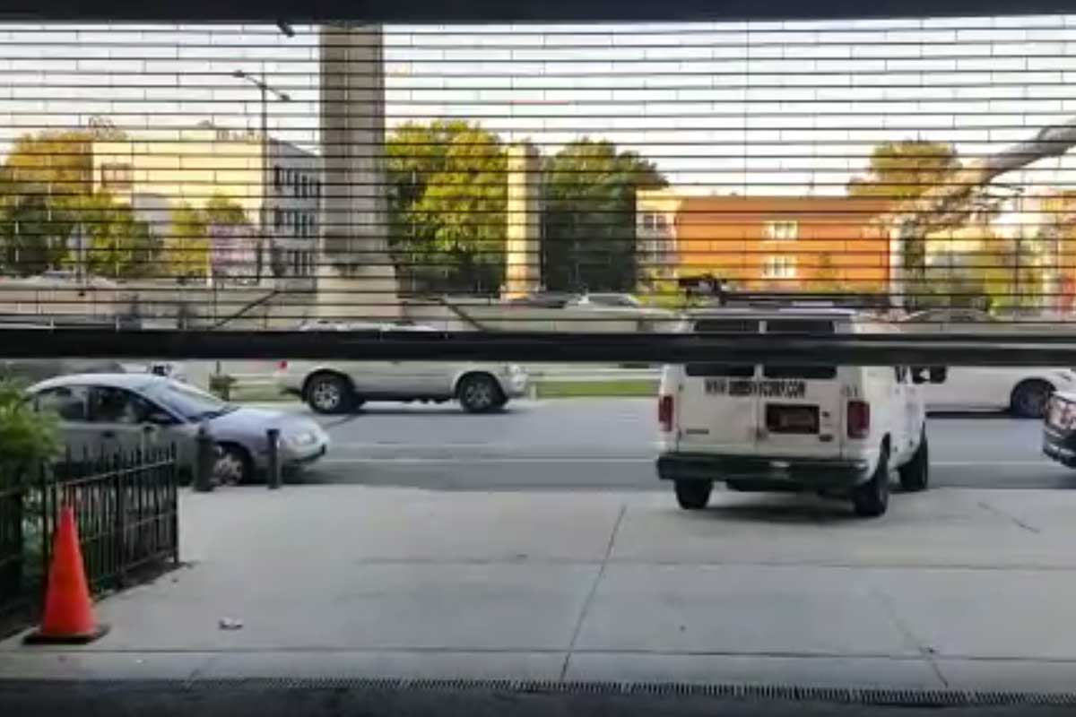 Parking Garage: remote-operated, chain-linked, motorzied rolling gate instalaltion